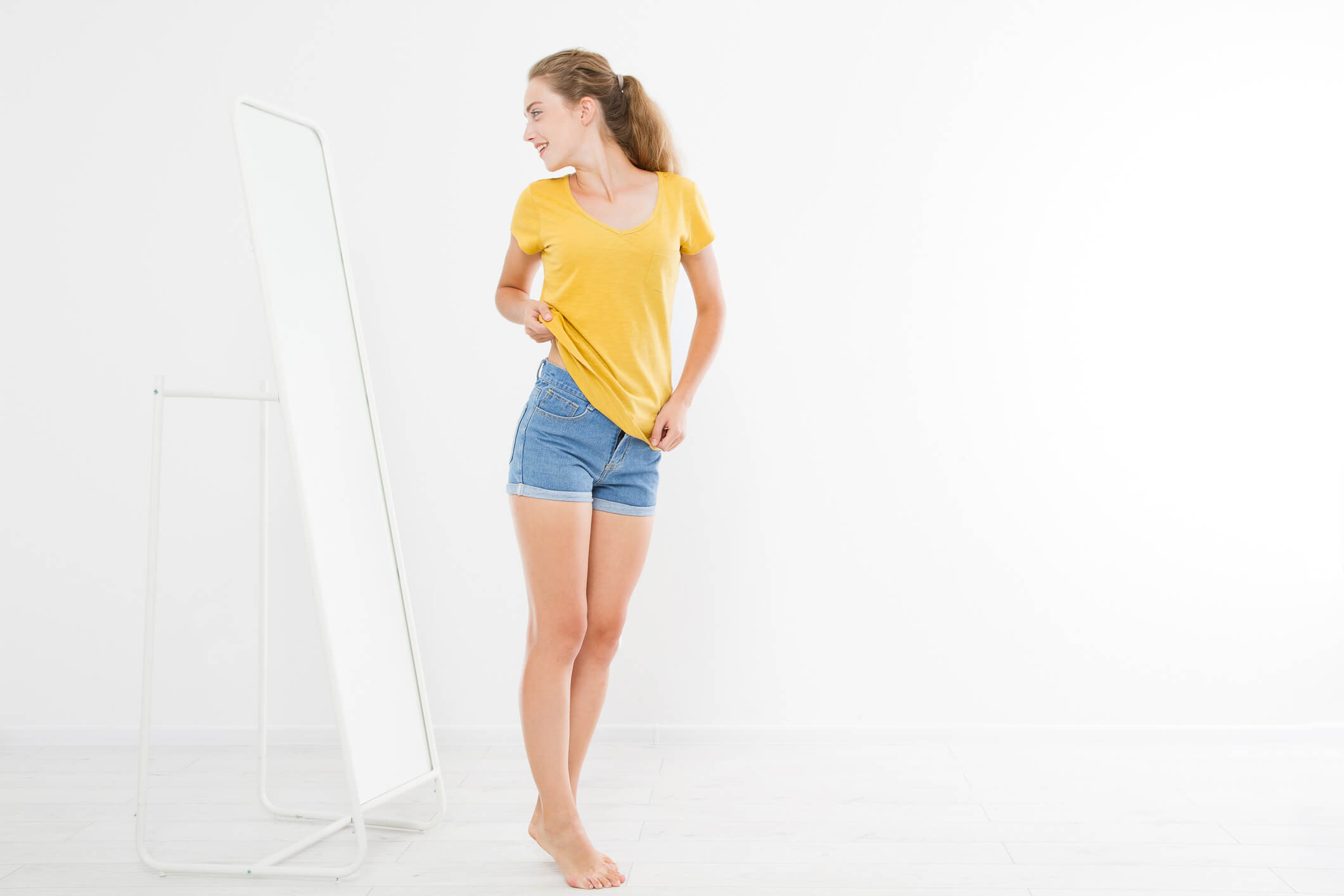 woman checking out herself in the mirror