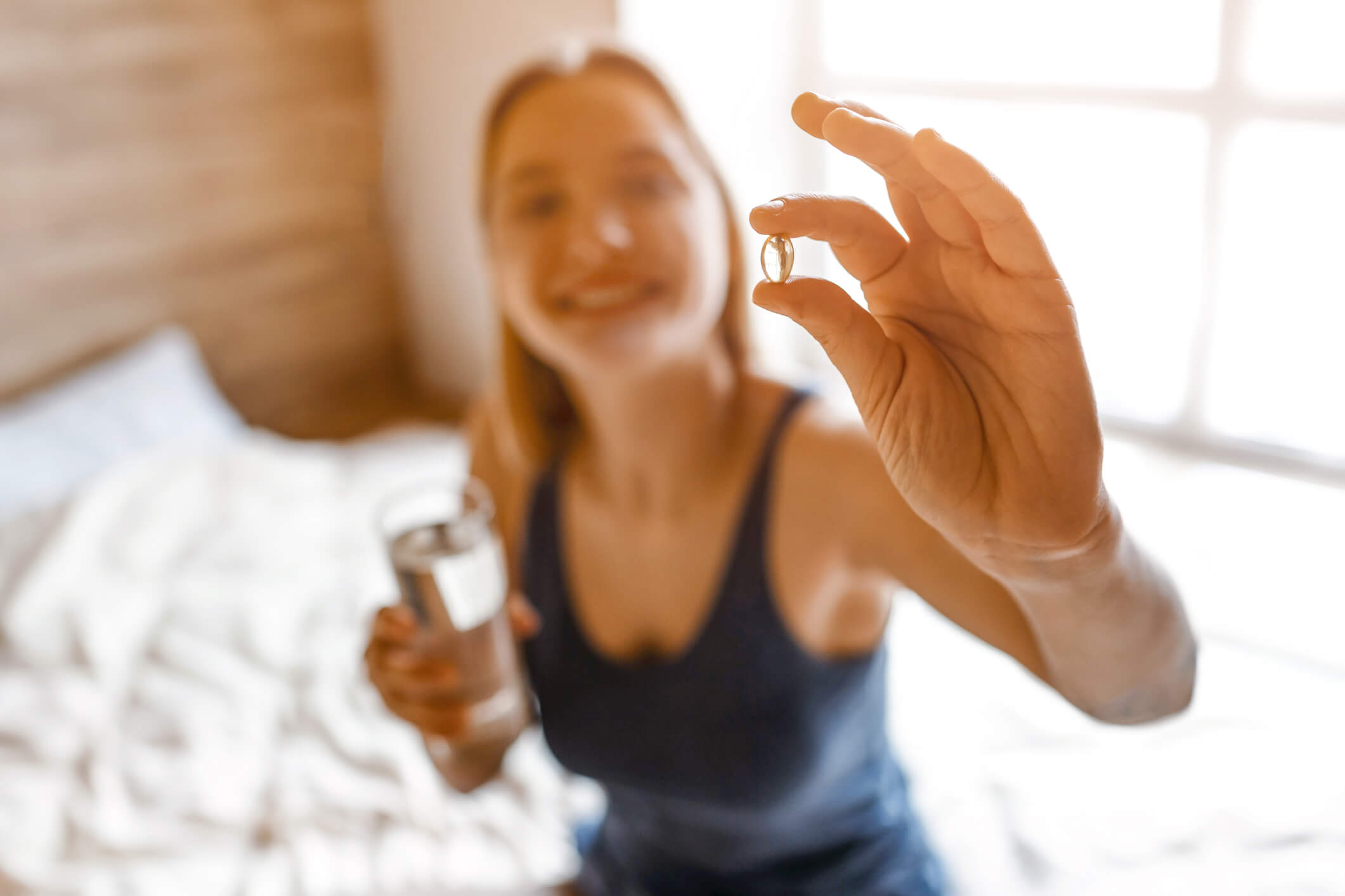 woman showing softgel